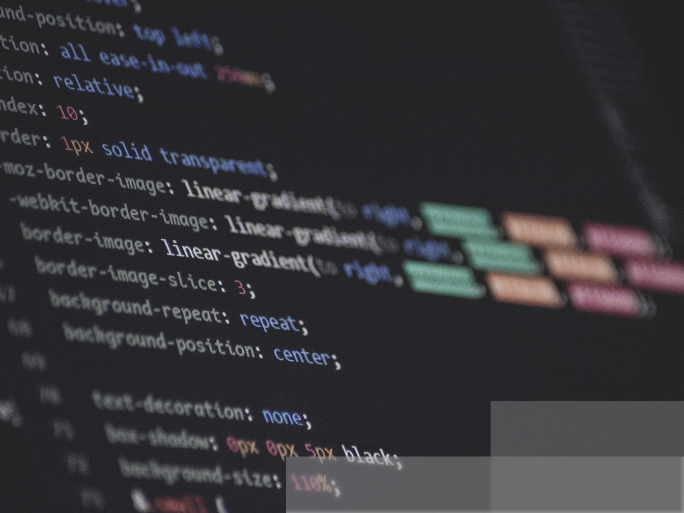 a close up of a computer screen with css code on it.